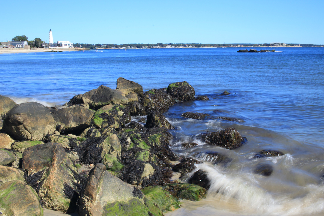 rocky shoreline at low tide in summer new london connecticut
